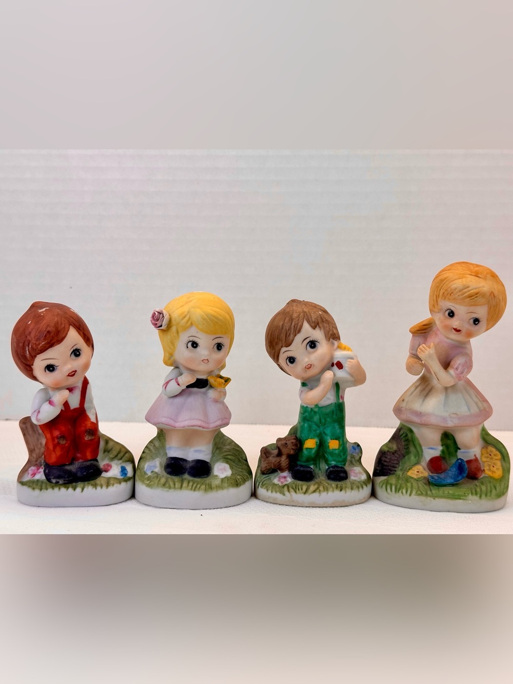 vintage bisque porcelain wide eyed children figurines